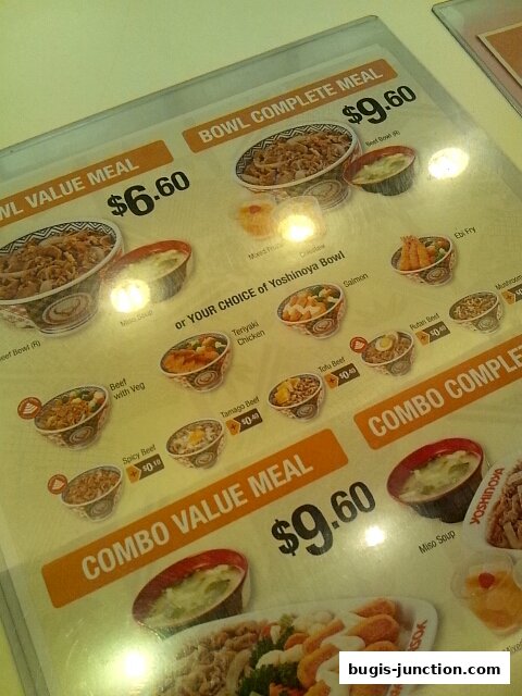 A menu from Yoshinoya showcasing various bowl meals and combo meals with prices.