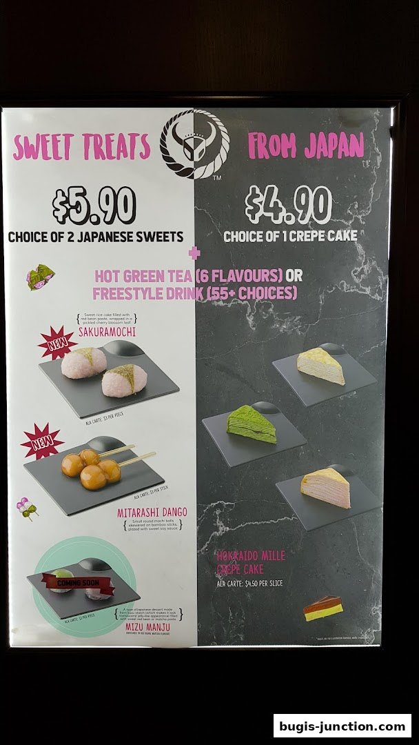 A menu board showcasing Japanese sweets like Sakuramochi, Mitarashi Dango, and Mille Crepe Cakes.