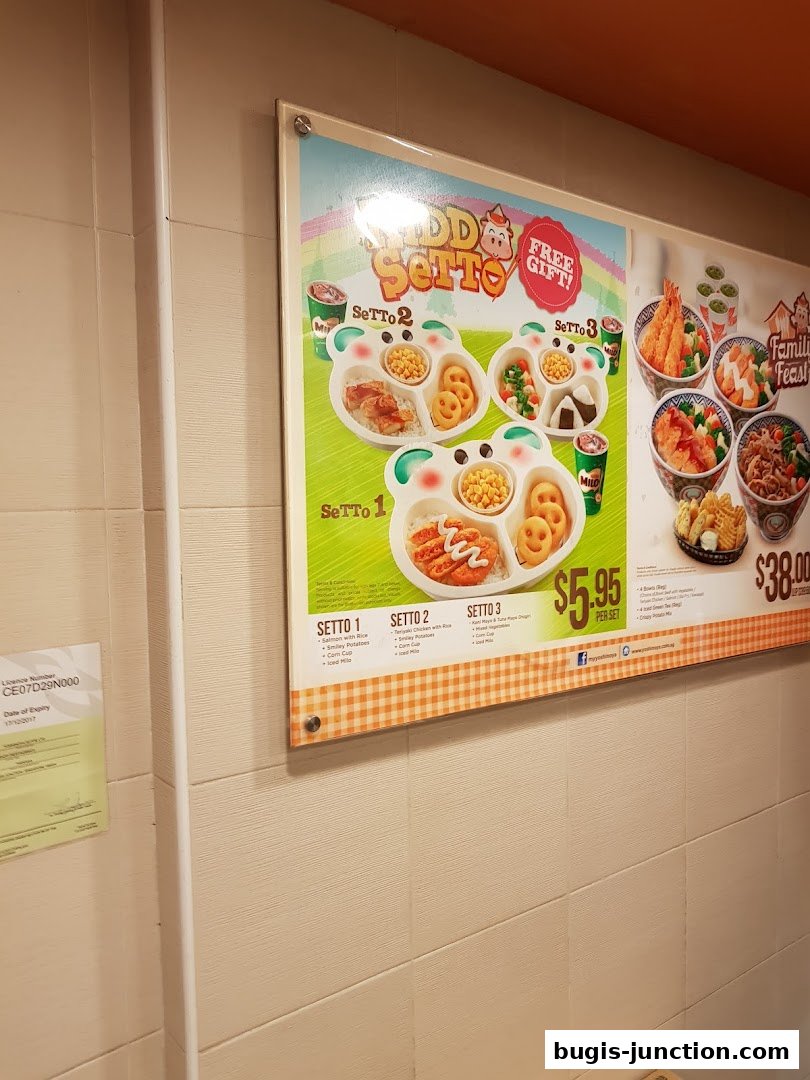 A menu board displaying Yoshinoya's Setti meals with prices and descriptions.