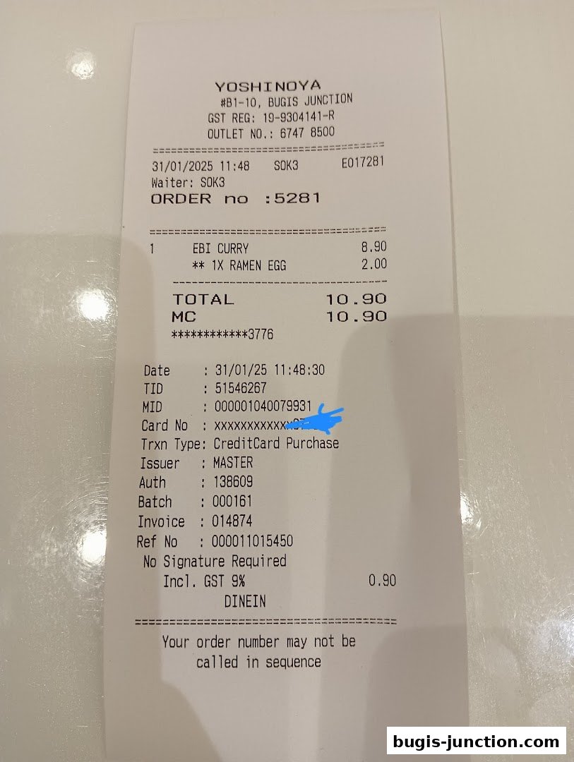 A receipt from Yoshinoya Bugis Junction showing a purchase of Ebi Curry and Ramen Egg.